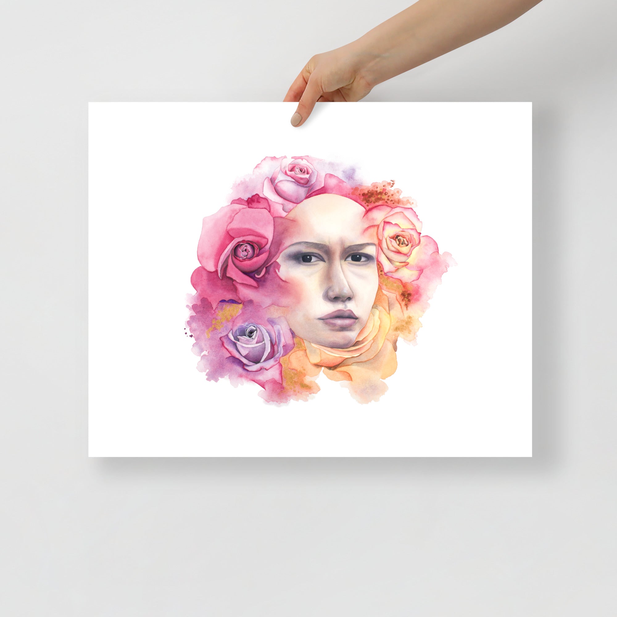 Hand holding a 16x20 unframed giclée print of A Quiet Moment by Paula Di Marco, a surreal watercolor portrait of a woman surrounded by vivid roses, evoking beauty, strength, and divine femininity.